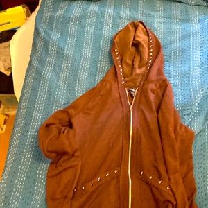 Large light weight brown jacket with metal studs. Never worn but washed.